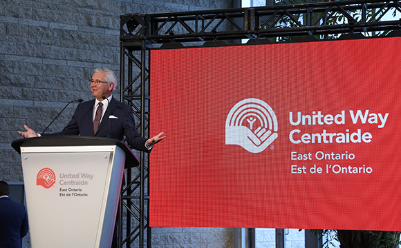Michael Allen on stage talking about United Way East Ontario