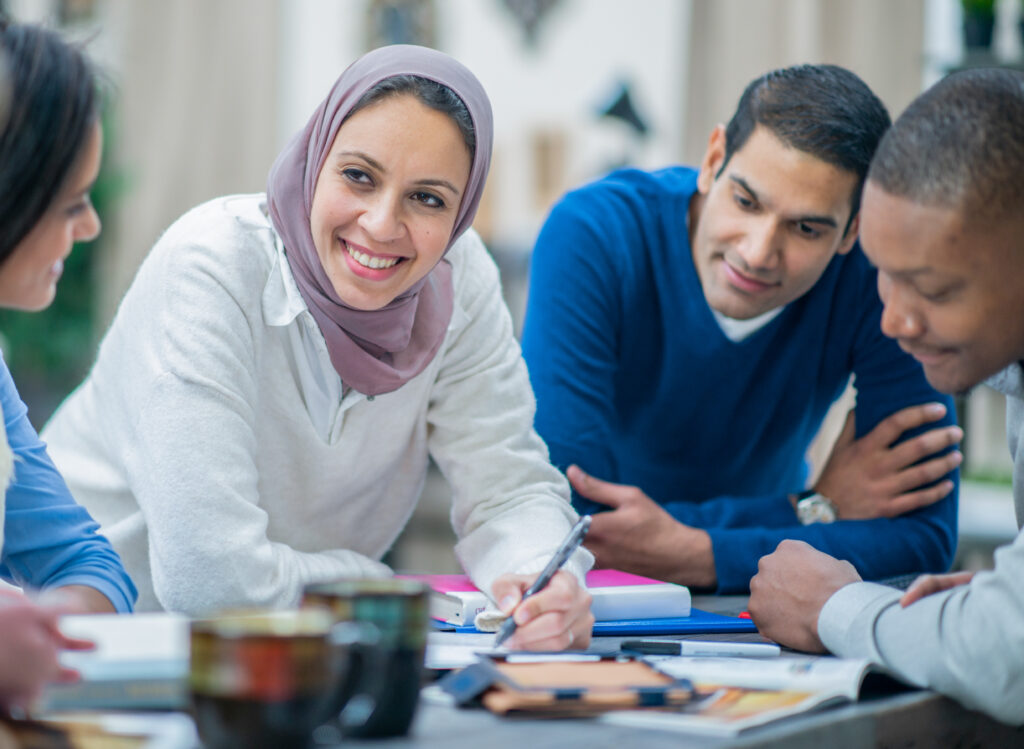 A photo of people working on a task together.